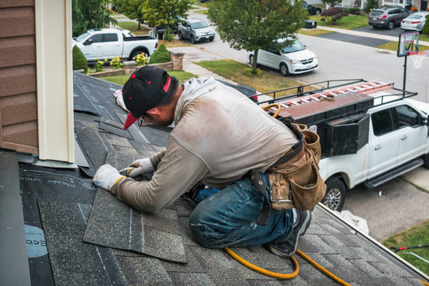 Professional Roofing technician working in Peabody, MA